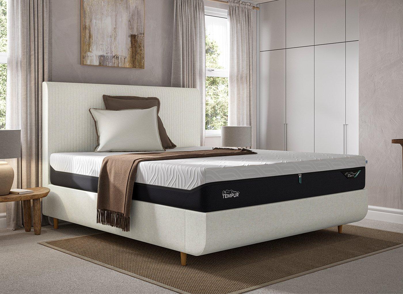 A TEMPUR bed frame with a TEMPUR mattress, set in a bedroom