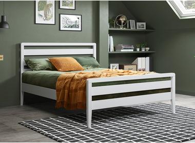 A bed frame against the wall with a window frame