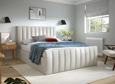 A bed in a bedroom with background