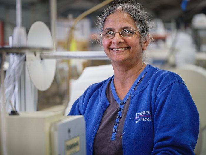 Seamstress working at the Dreams bed factory