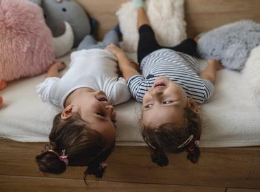 Kids lying on a bed