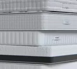 Maidstone mattress on a wooden bed frame