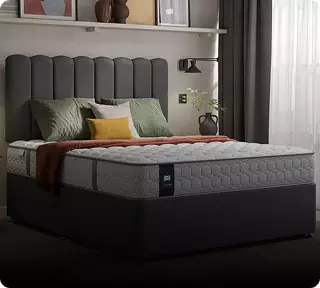 Image of a Sealy mattress on a gray bed frame