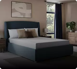 Image of a Tempur mattress on a green bed frame