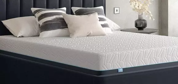 Hyde&Sleep mattress on a black bed frame.