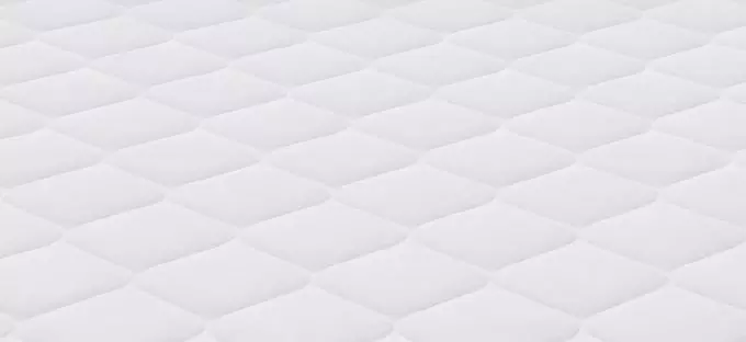 White mattress pattern background.