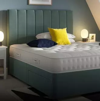 Billingham mattress on white bedframe in a bedroom setting.