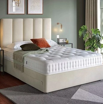 Flaxby natural mattress on a bed in a bedroom