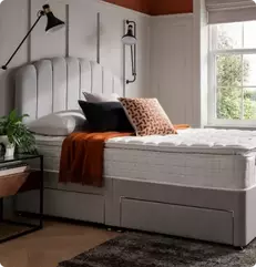 Image of a bed and mattress in a bedroom
