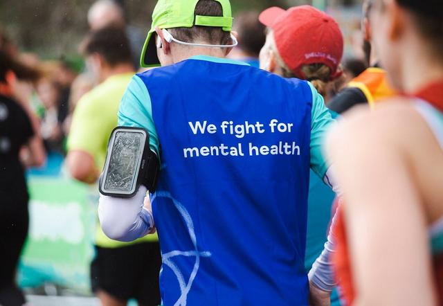 Two people jogging in Mind t-shirts