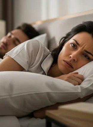 Bed frame against a wall with window frame