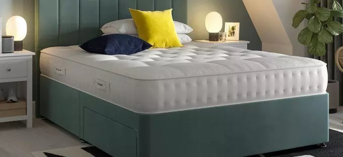 Green divan in a bedroom setting as background image.